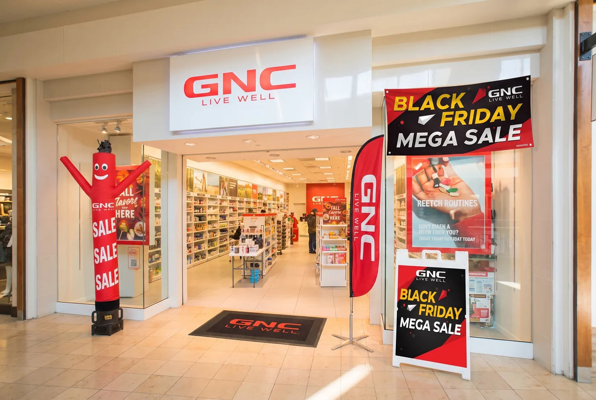 Retail storefront setup with a custom Air Dancer, feather flag, banner, A-frame sign and door mat